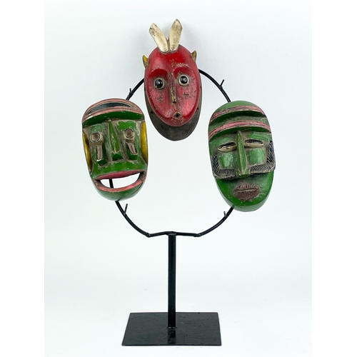 12 - BETE MASKS, a set of three, Ivory Coast, 47cm H. (3)