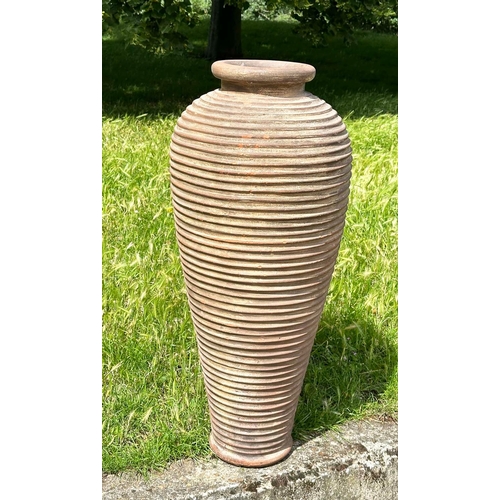 134 - TALL GARDEN AMPHORA, weathered terracotta urn of tapered form with ribbed detail, 99cm H.