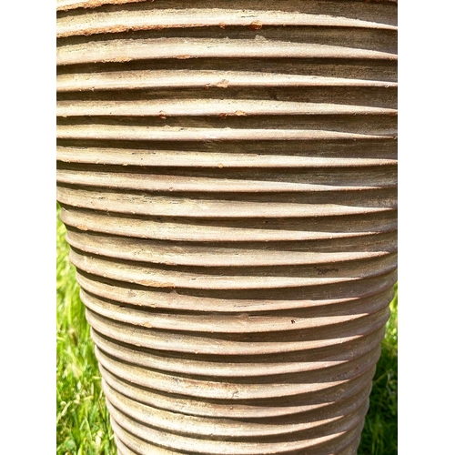 134 - TALL GARDEN AMPHORA, weathered terracotta urn of tapered form with ribbed detail, 99cm H.