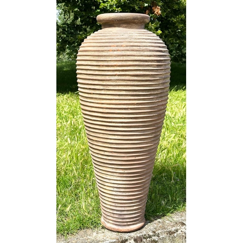 134 - TALL GARDEN AMPHORA, weathered terracotta urn of tapered form with ribbed detail, 99cm H.