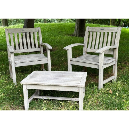 135 - GARDEN ARMCHAIRS, a pair, well weathered teak slatted with curved arms, 75cm H x 78cm W, together wi... 