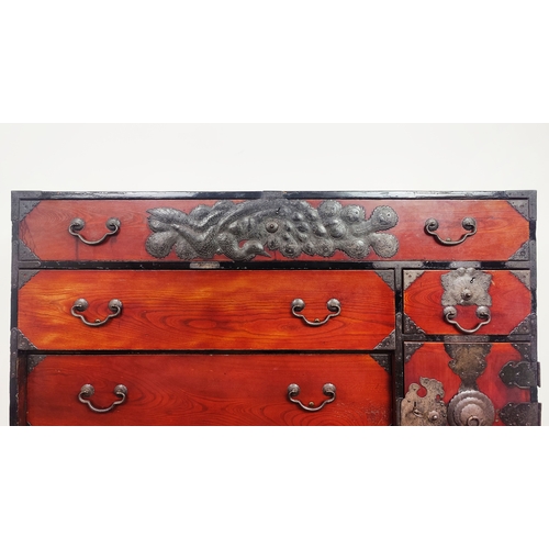 149 - JAPANESE CHEST, 19th century elm, firwood and iron mounted, with nine drawers and a door on large wo... 