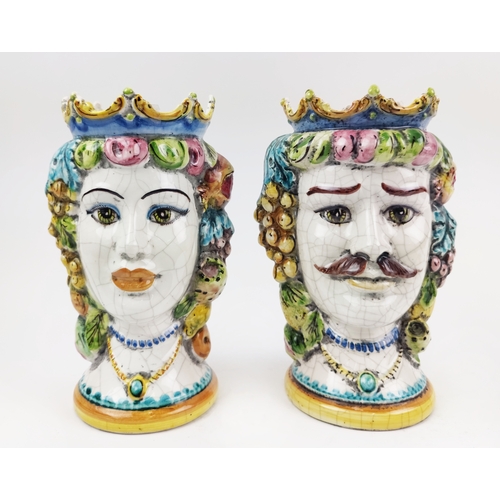 18 - SICILIAN CERAMIC HEAD VASES, a pair, a lady and a gentleman, with hanging fruit embellishments, 26cm... 