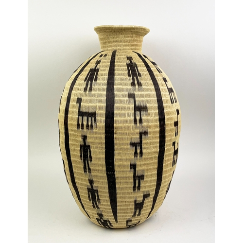 25 - COLOMBIAN WERREGUE WOVEN PALM VASE,  55cm H.