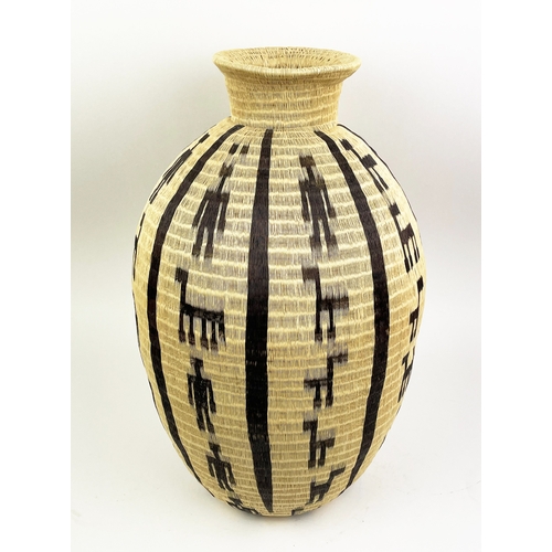 25 - COLOMBIAN WERREGUE WOVEN PALM VASE,  55cm H.