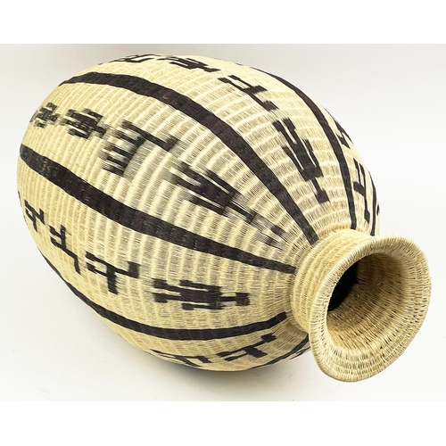 25 - COLOMBIAN WERREGUE WOVEN PALM VASE,  55cm H.