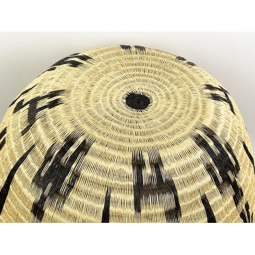 25 - COLOMBIAN WERREGUE WOVEN PALM VASE,  55cm H.