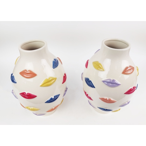 421 - CERAMIC VASES, a pair, decorated with multi-coloured lips, 41cm H x 23cm W. (2)