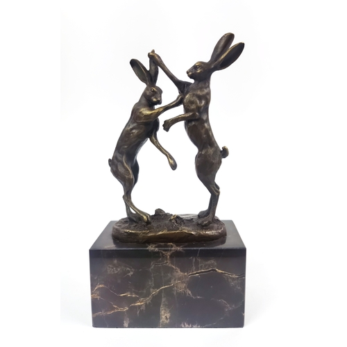 432 - CONTEMPORARY SCHOOL BOXING HARES, cast metal, on marble base, 26cm H.