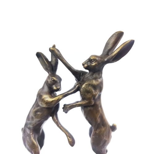 432 - CONTEMPORARY SCHOOL BOXING HARES, cast metal, on marble base, 26cm H.