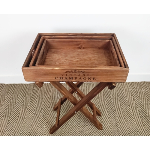 433 - WOODEN TRAYS ON STAND, a graduated set of three on one stand, 79cm H x 56cm W x 38cm D. (3)