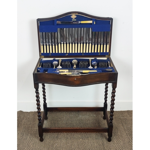 447 - CANTEEN OF CUTLERY, in an oak cased table, 72cm H x 64cm W x 39cm D.