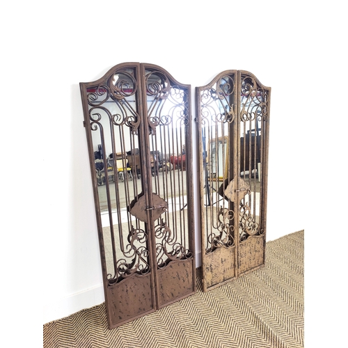 448 - GARDEN MIRRORS, a pair, metal frames, gated design, 128cm H x 52cm W. (2)