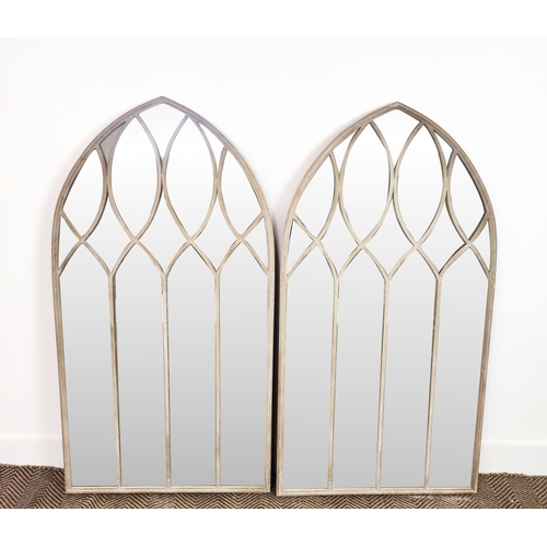 450 - ARCHITECTURAL GARDEN MIRRORS, a pair, with arched metal frames, 125cm H x 65cm W. (2)