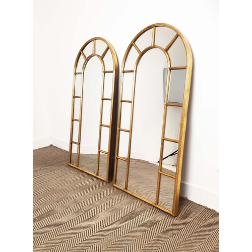 423 - WALL MIRRORS, a pair, gilt arched frames, 124cm H x 64cm W. (2)