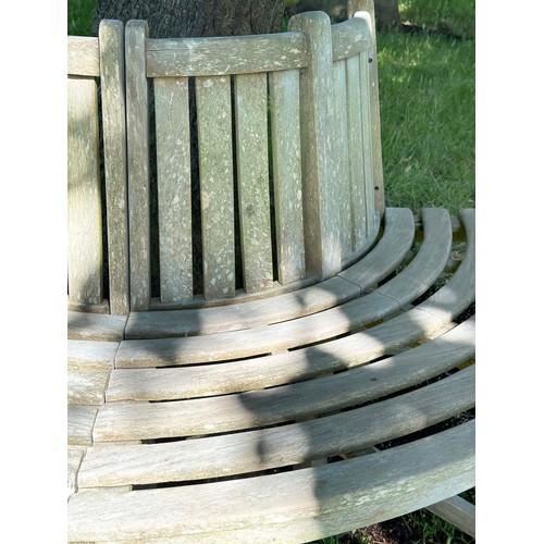 139 - GARDEN TREE BENCH, nicely weathered teak forming half round (two quadrants) of slatted form with upr... 