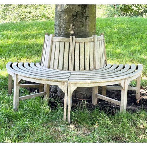 139 - GARDEN TREE BENCH, nicely weathered teak forming half round (two quadrants) of slatted form with upr... 