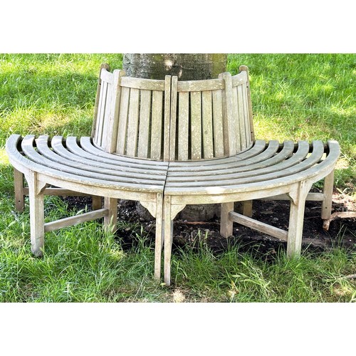 139 - GARDEN TREE BENCH, nicely weathered teak forming half round (two quadrants) of slatted form with upr... 