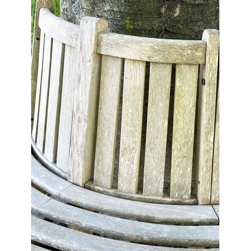 139 - GARDEN TREE BENCH, nicely weathered teak forming half round (two quadrants) of slatted form with upr... 