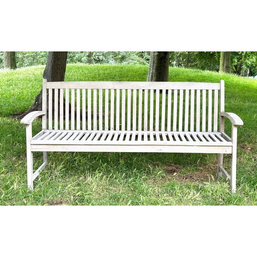 137 - GARDEN BENCH, well weathered teak slatted with slightly arched arms, 165cm W.