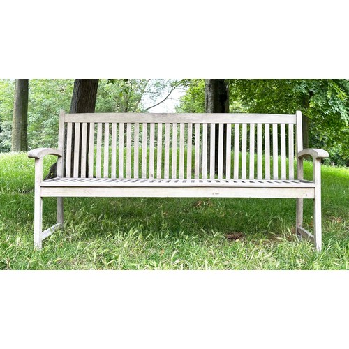 137 - GARDEN BENCH, well weathered teak slatted with slightly arched arms, 165cm W.