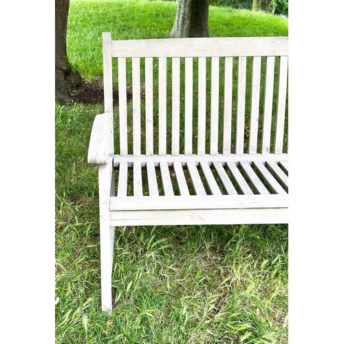 137 - GARDEN BENCH, well weathered teak slatted with slightly arched arms, 165cm W.