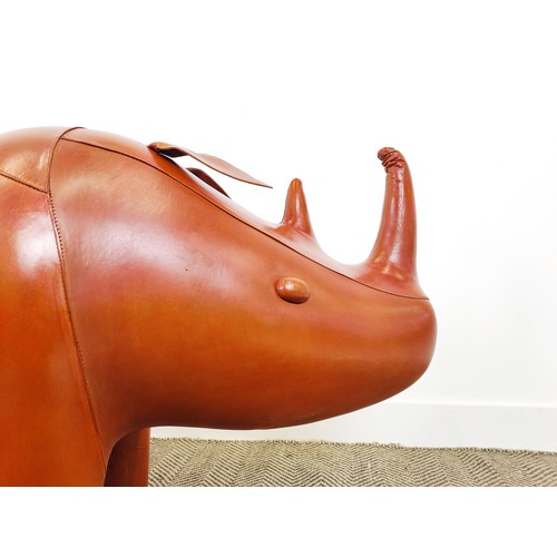 444 - LARGE RHINO FOOTSTOOL, tan leathered, 72cm H x 140cm l x 48cm W.