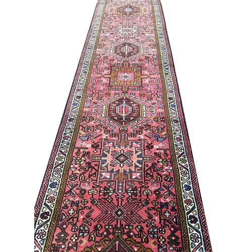 107 - PERSIAN KARAJA RUNNER, 388cm x 80cm.