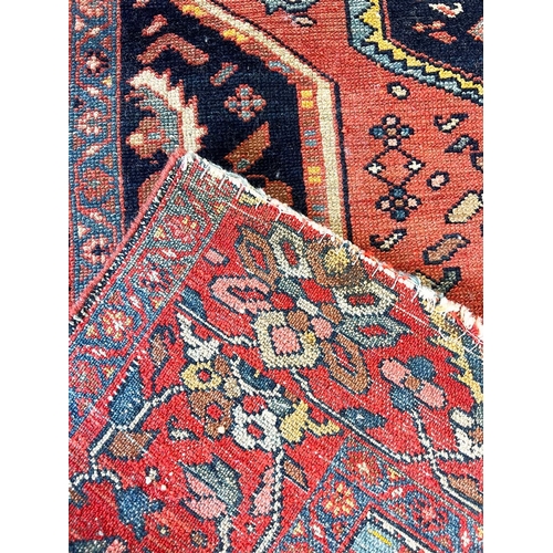 118A - ANTIQUE MALAYER RUG, 188cm x 131cm.