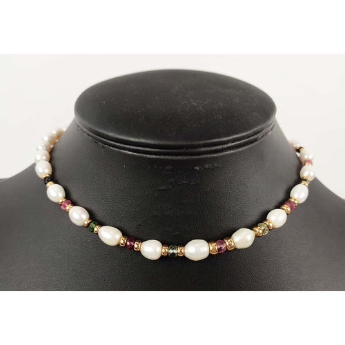 16 - A FRESHWATER PEARL SINGLE STRAND NECKLACE, the oval pearls partially interspaced with coloured stone... 