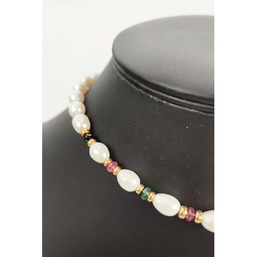 16 - A FRESHWATER PEARL SINGLE STRAND NECKLACE, the oval pearls partially interspaced with coloured stone... 