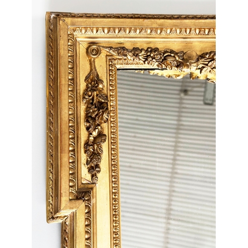 170 - WALL MIRROR, 19th century French giltwood and gesso, rectangular with ribbon crest, and beaded frame... 