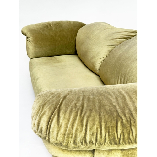 176 - HEALS SOFA, soft moss green velvet upholstered, with outswept cushion arms, 234cm W.