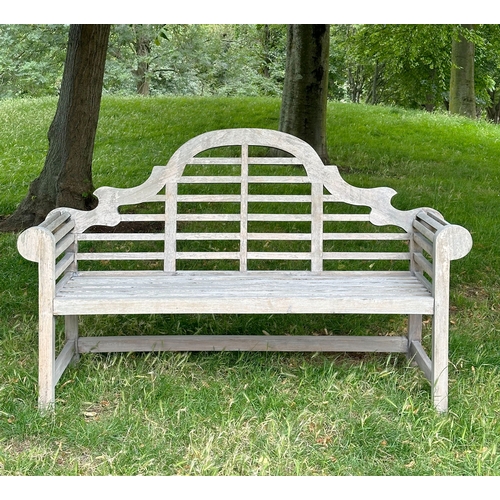 191 - LUTYEN GARDEN BENCH, well weathered teak of slatted and dowelled construction after the design by Si... 