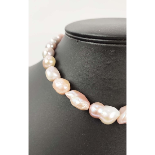 23 - A BAROQUE PEARL SINGLE STRAND NECKLACE, set with large AAA grade (approx.) high lustre Champagne pea... 