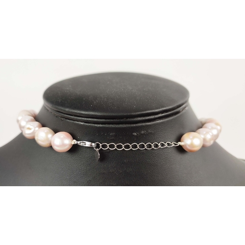 23 - A BAROQUE PEARL SINGLE STRAND NECKLACE, set with large AAA grade (approx.) high lustre Champagne pea... 