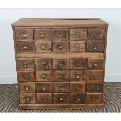 139 - EARLY 20TH CENTURY OAK AND PINE FILING CHEST, fitted with thirty drawers, 102cm H x 103cm x 52cm D.