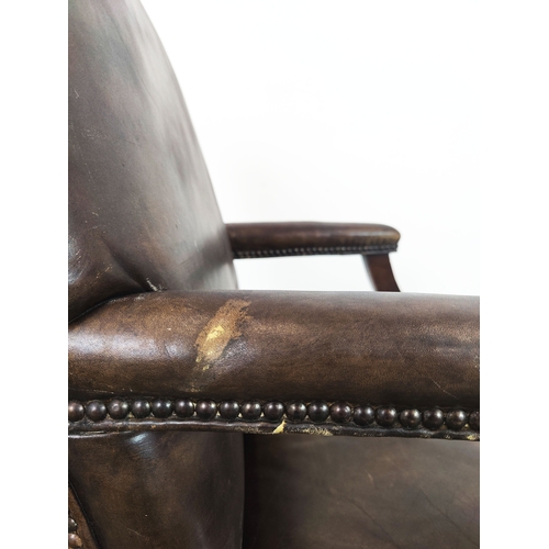 128 - GAINSBOROUGH STYLE ARMCHAIR, Georgian manner in brown leather, 100cm H x 60cm W x 67cm D.