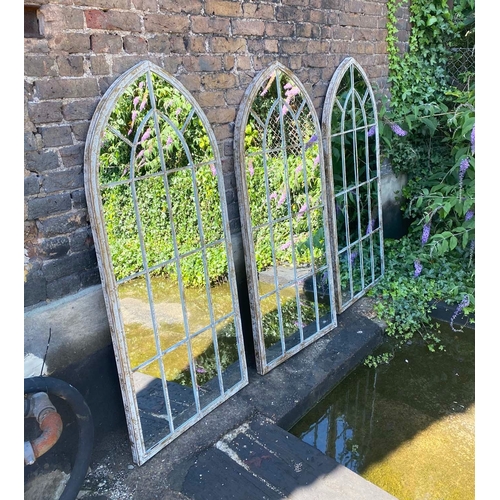 349 - ARCHITECTURAL GARDEN MIRRORS, a set of three, arched metal frames, 160cm H x 67cm W. (3)