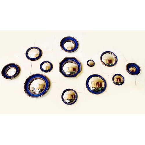 354 - CONVEX MIRRORS, a collection of twelve, blue and gilt frames, various sizes and designs, 26cm diam. ... 