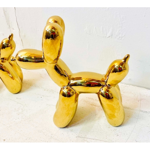 357 - CONTEMPORARY SCHOOL BALLOON DOG SCULPTURES, gilt ceramic, a set of three, 22cm H x 8cm W x 22c, D. (... 