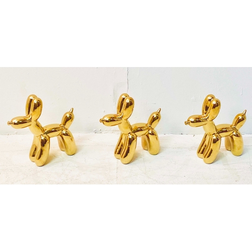 357 - CONTEMPORARY SCHOOL BALLOON DOG SCULPTURES, gilt ceramic, a set of three, 22cm H x 8cm W x 22c, D. (... 