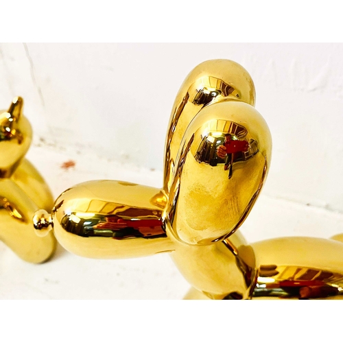 357 - CONTEMPORARY SCHOOL BALLOON DOG SCULPTURES, gilt ceramic, a set of three, 22cm H x 8cm W x 22c, D. (... 