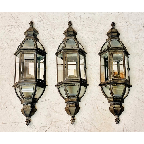 360 - WALL LANTERNS, a set of three, mirrored backs and distressed metal, 71cm H x 22cm W. (3)