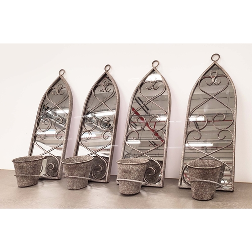 363 - ARCHITECTURAL GARDEN MIRRORS, a set of four, metal arched frames with plant pot holders, 58cm H x 28... 