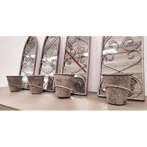 363 - ARCHITECTURAL GARDEN MIRRORS, a set of four, metal arched frames with plant pot holders, 58cm H x 28... 