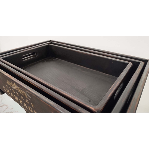 382 - TRAYS ON STAND, graduated set of three, in black painted finish, 79cm H x 56cm W x 38cm D.