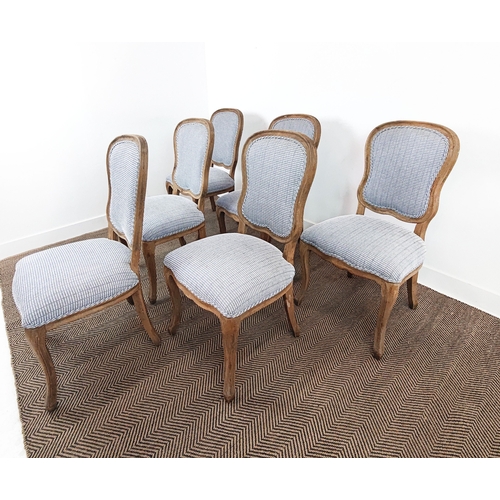 383 - DINING CHAIRS, a set of six in a blue and white patterned fabric with wooden show frames. (6)