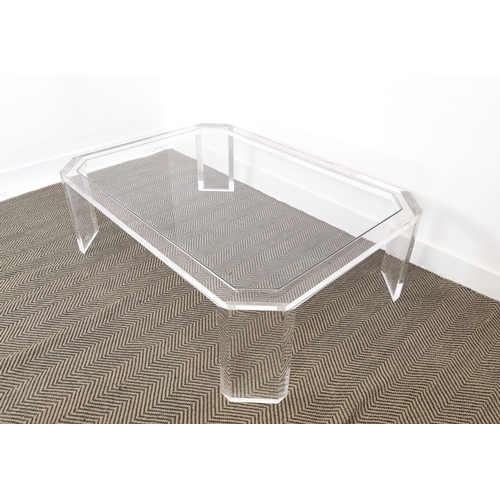 384 - LOW TABLE, perspex with a glass top and canted corners, 89cm D x 40cm H x 122cm W.