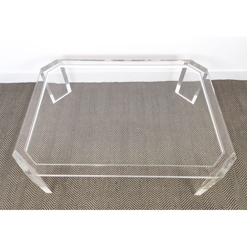 384 - LOW TABLE, perspex with a glass top and canted corners, 89cm D x 40cm H x 122cm W.